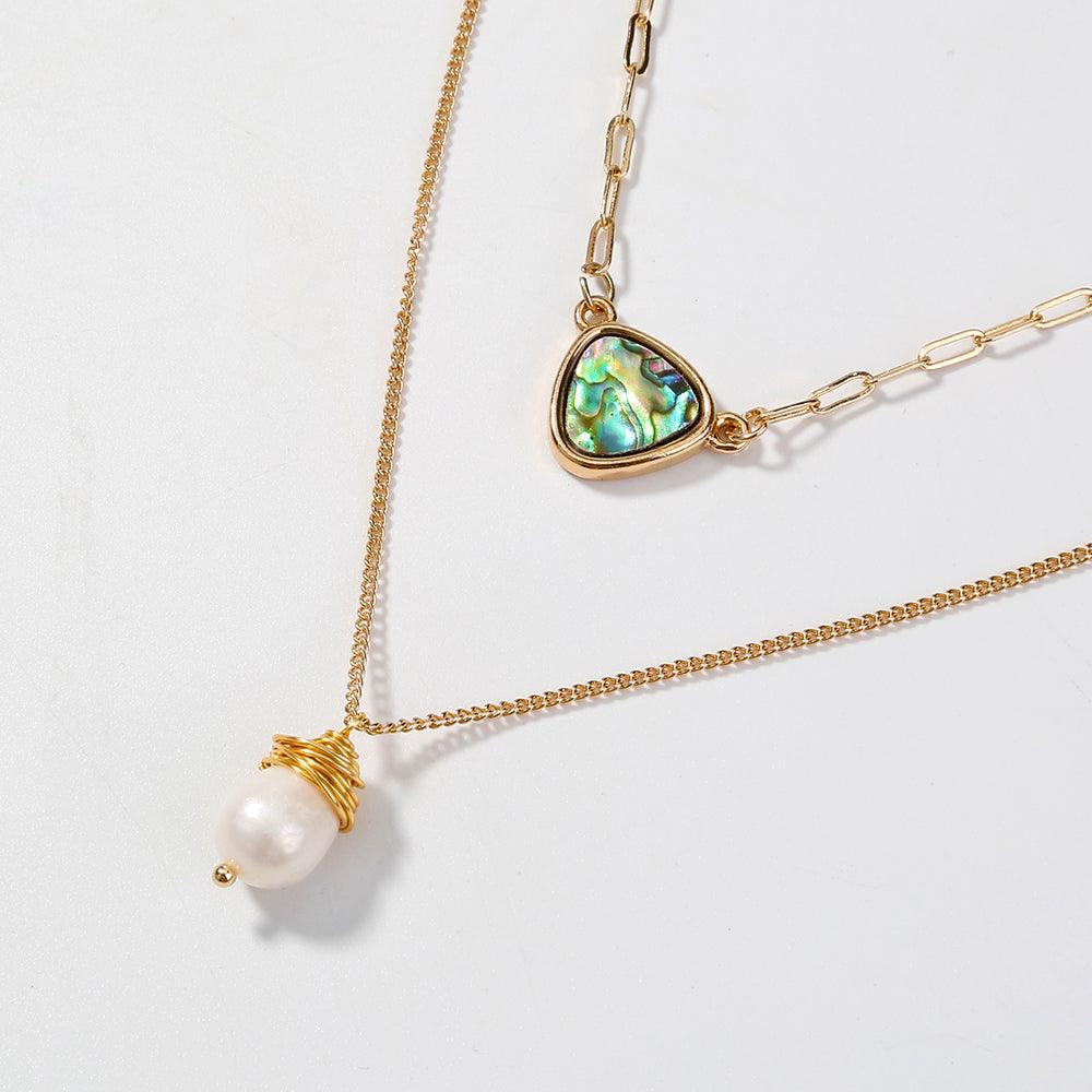 Two-layer gold necklace with abalone heart pendant and wrapped white pearl drop