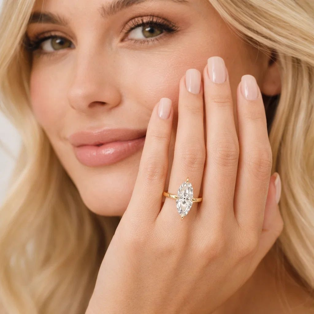 Marquise solitaire ring on hand with clear center stone