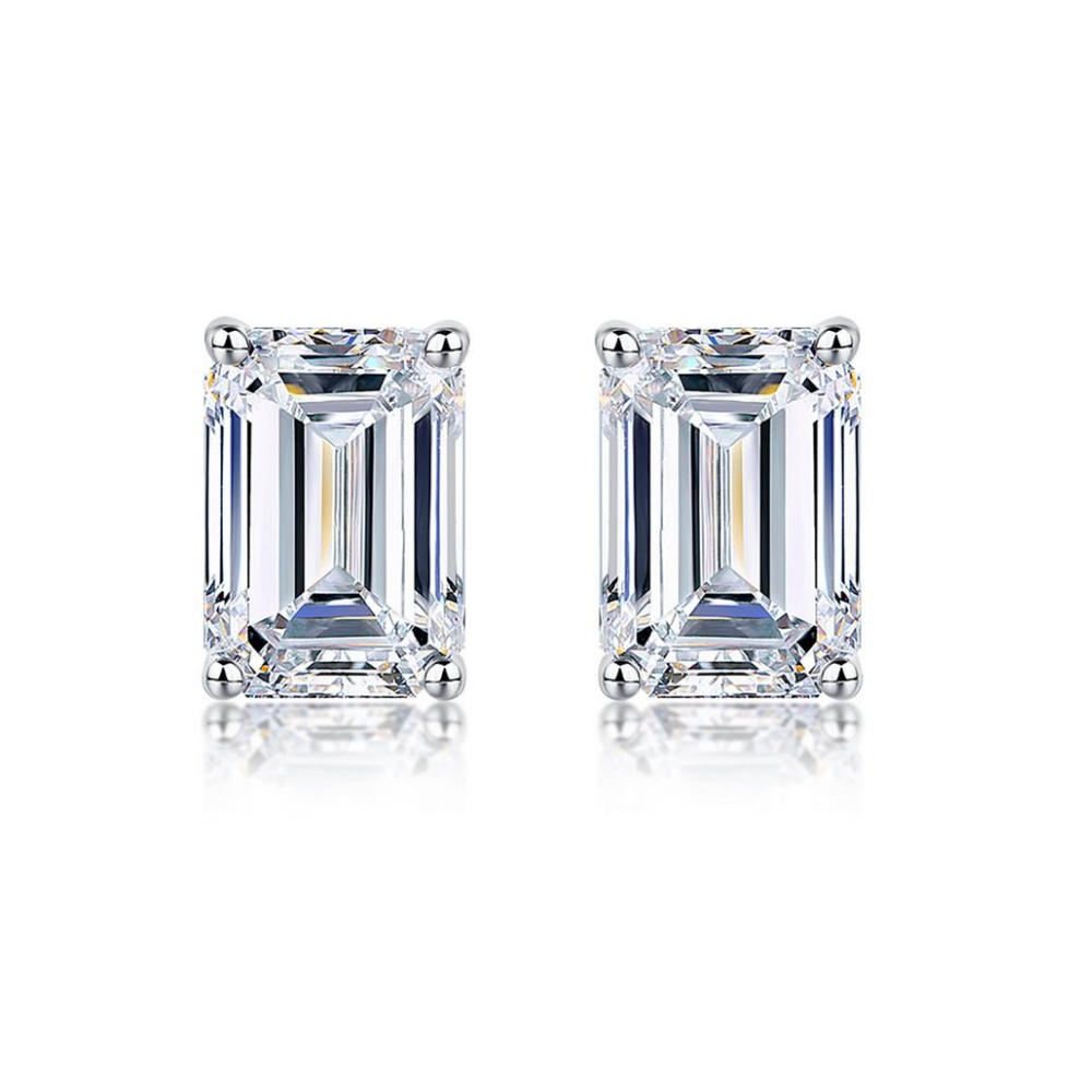 Silver-toned emerald-cut stud earrings with square faceted center stones