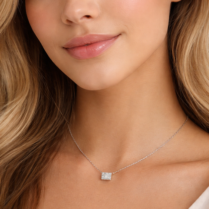 Close-up emerald-cut pendant necklace with silver-tone chain and rectangular stone