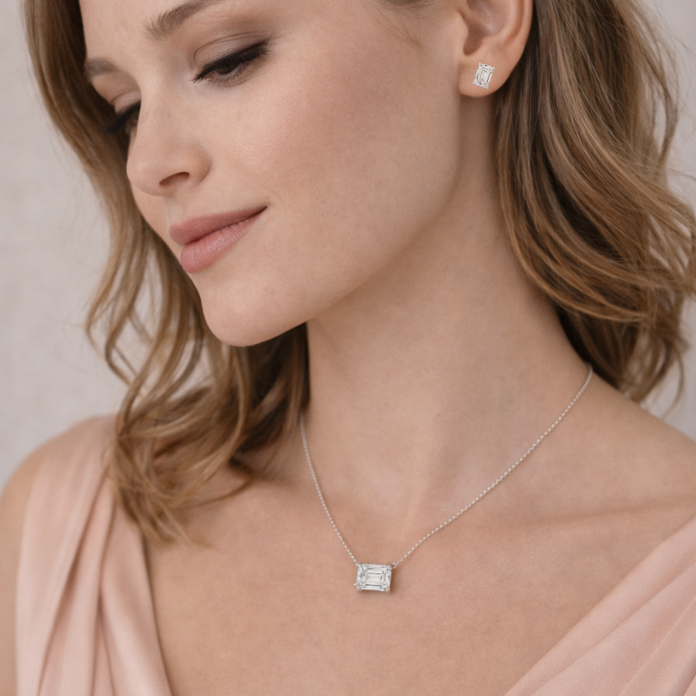 Emerald-cut pendant necklace on model, silver-tone chain and rectangular stone