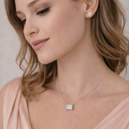 Emerald-cut pendant necklace on model, silver-tone chain and rectangular stone
