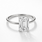 Silver-tone emerald-cut solitaire ring, front view of raised moissanite stone