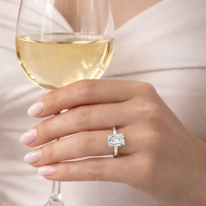 Gold vermeil emerald-cut solitaire ring, centered on finger