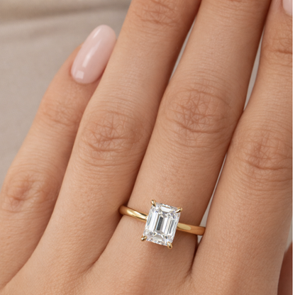 Gold vermeil emerald-cut solitaire ring featuring a rectangular step-cut center stone