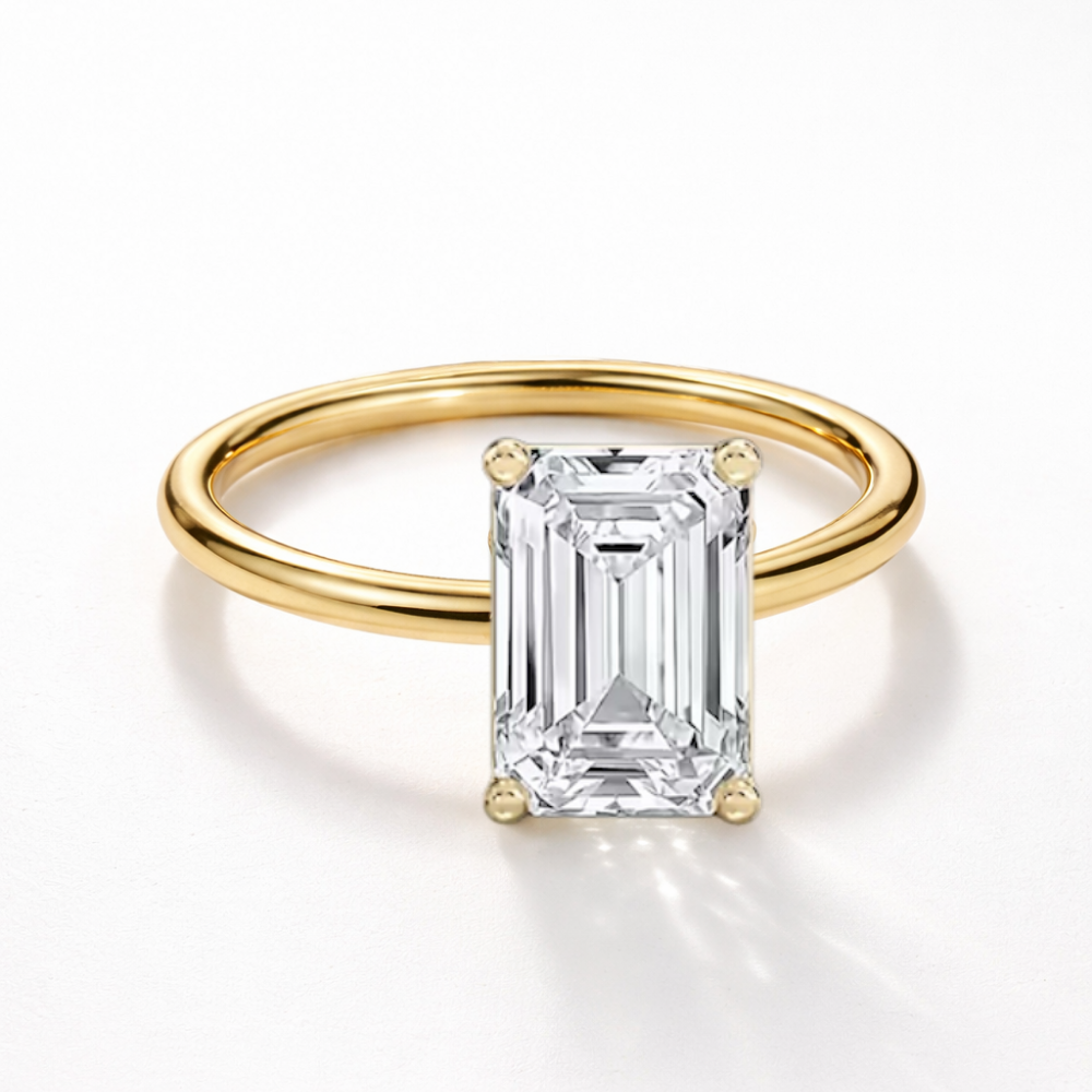Gold vermeil emerald-cut solitaire ring with rectangular step-cut center stone on white