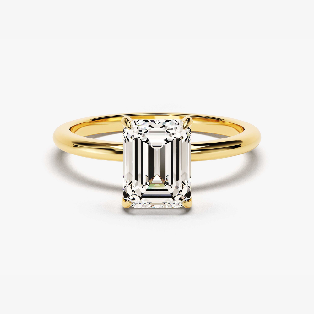 Gold vermeil emerald-cut solitaire ring with rectangular step-cut center stone, angled view