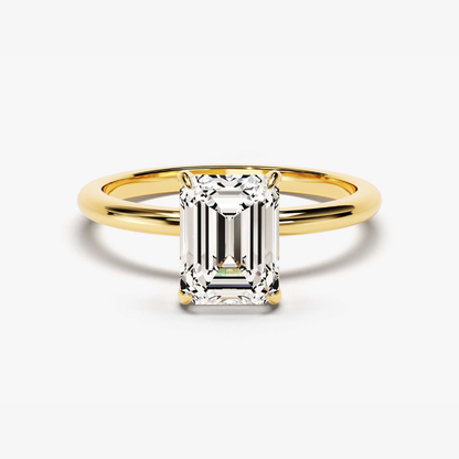 Gold vermeil emerald-cut solitaire ring with rectangular step-cut center stone, angled view