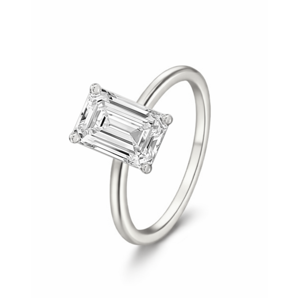 Silver-tone emerald-cut solitaire ring with four-corner prong setting