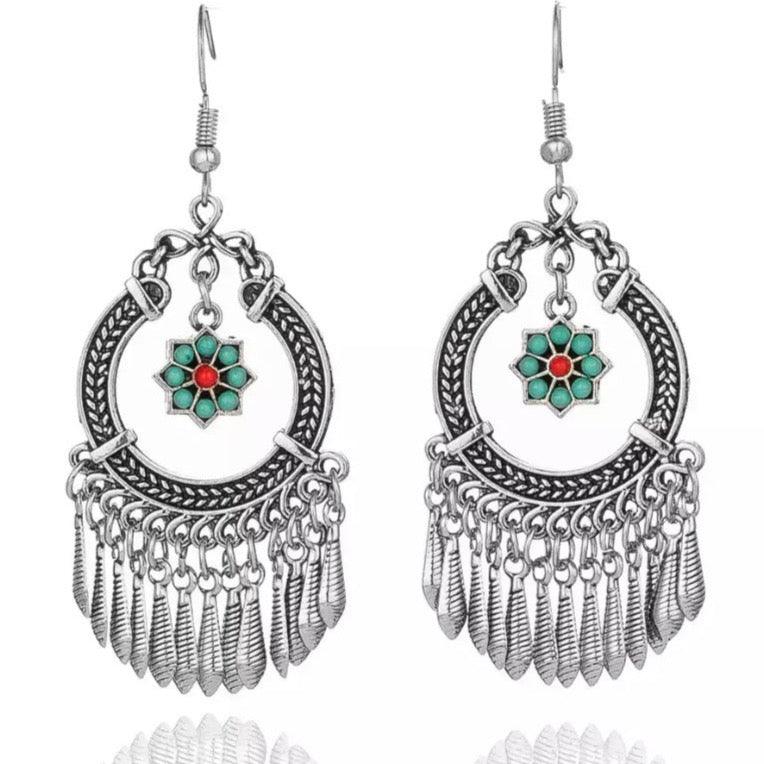 Silver-tone flower dangle earrings with hoop filigree and turquoise/red center tassels
