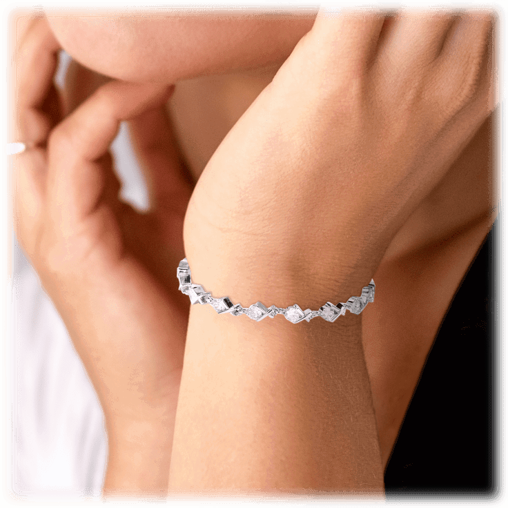 Silver-tone tennis bracelet with rectangular clear CZ stones on wrist