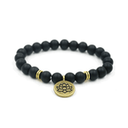 Yoga bracelet with black beads and round lotus charm, gold spacer rings
