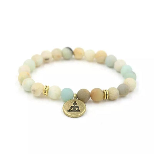 Yoga bracelet with light beads and round Buddha charm, gold accent rings