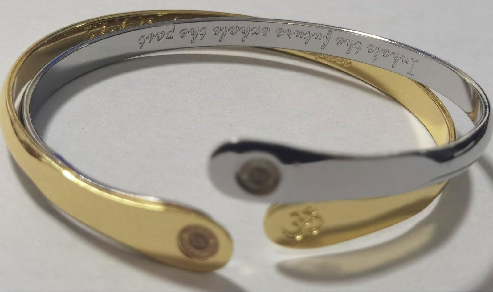 Two-tone metal yoga bracelet with Om engraving and round stamped discs