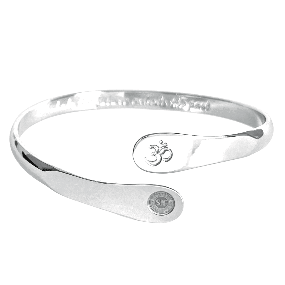 Silver yoga bracelet with engraved Om symbol and two round stamped discs