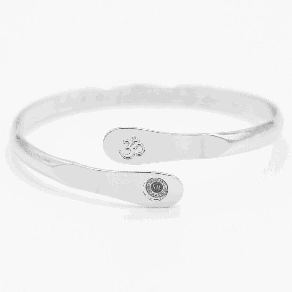 Silver yoga bracelet with engraved Om symbol plate and small round logo on side