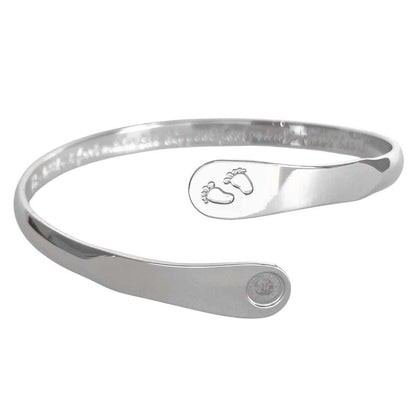 Silver baby footprint engraved bracelet featuring stamped feet motif and circular hallmark