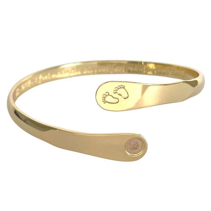 Gold baby footprint engraved bracelet featuring stamped feet motif and circular hallmark