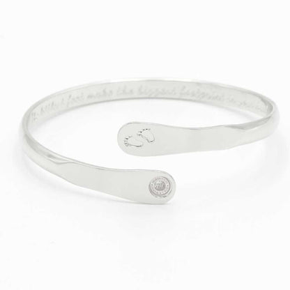 Silver baby footprint engraved bangle bracelet with circular hallmark charm