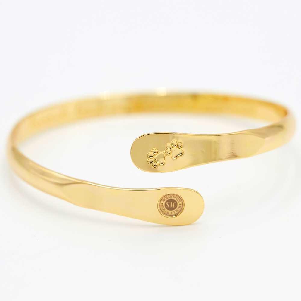 Gold pet paw-print bangle bracelet, engraved paw center and oval logo plate