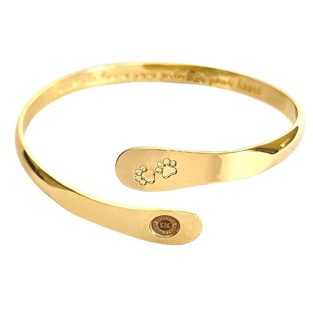 Gold pet paw-print bangle bracelet with engraved paw and oval logo plate