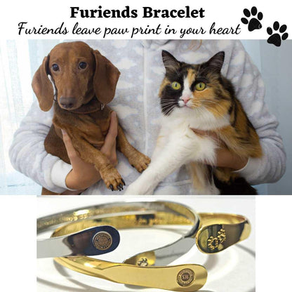 Gold pet paw-print bracelet with engraved paw center and oval logo plate